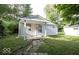 Cute ranch home with covered porch and stone pathway at 1519 E Mills Ave, Indianapolis, IN 46227