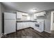 Clean kitchen, featuring white cabinets and dark floors at 1519 E Mills Ave, Indianapolis, IN 46227