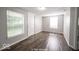 Bright living room with hardwood floors and neutral walls at 1519 E Mills Ave, Indianapolis, IN 46227
