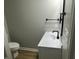 Modern bathroom with white vanity and black fixtures at 706 W Franklin St, Thorntown, IN 46071