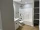 Clean bathroom with a tub, shower, and built-in shelving at 706 W Franklin St, Thorntown, IN 46071
