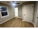 Spacious bedroom with wood-look floors and ceiling fan at 706 W Franklin St, Thorntown, IN 46071