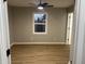 Simple bedroom with ceiling fan and vinyl plank flooring at 706 W Franklin St, Thorntown, IN 46071