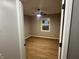 Bright bedroom with wood-look floors and ceiling fan at 706 W Franklin St, Thorntown, IN 46071
