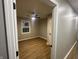 Bright bedroom with wood-look floors and ceiling fan at 706 W Franklin St, Thorntown, IN 46071