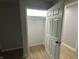 Spacious walk-in closet with wood-look floors at 706 W Franklin St, Thorntown, IN 46071