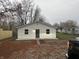 Newly built home with white siding, dark gray door and walkway at 706 W Franklin St, Thorntown, IN 46071