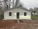 Newly constructed home with white siding, dark gray door, and small front yard at 706 W Franklin St, Thorntown, IN 46071