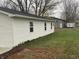 White vinyl sided home with new gutters and landscaping at 706 W Franklin St, Thorntown, IN 46071