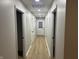 Light gray hallway with vinyl plank flooring and multiple doors at 706 W Franklin St, Thorntown, IN 46071