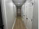 Bright hallway with wood-look floors and access to rooms at 706 W Franklin St, Thorntown, IN 46071