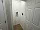 Laundry closet with hookups and shelving at 706 W Franklin St, Thorntown, IN 46071