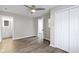 Bedroom with ceiling fan, access to bathroom and double door closet at 802 N Tuxedo St, Indianapolis, IN 46201