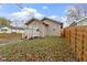 House exterior with front yard, steps, and wooden fence at 802 N Tuxedo St, Indianapolis, IN 46201