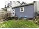 Detached garage and small backyard with patio and lawn at 907 S East St, Indianapolis, IN 46225
