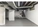 Unfinished basement area with steps and storage space at 907 S East St, Indianapolis, IN 46225