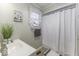 Clean bathroom with shower/tub and updated vanity at 907 S East St, Indianapolis, IN 46225