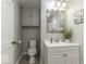 Updated bathroom with vanity, toilet and shower at 907 S East St, Indianapolis, IN 46225