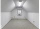 Bright, spacious bonus room with window and carpet flooring at 907 S East St, Indianapolis, IN 46225