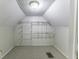 Large attic closet with wire shelving and hanging rod at 907 S East St, Indianapolis, IN 46225