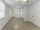 Open concept living area with hardwood floors and ceiling fans at 907 S East St, Indianapolis, IN 46225