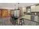 Eat-in kitchen with island, granite counters, and stainless steel appliances at 1669 E Greyhawk Way, Greenfield, IN 46140
