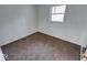 Simple bedroom with brown carpet and a window offering natural light at 268 E Hoover Dr, , IN 46164