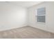 Simple bedroom with neutral carpeting and window at 4542 Hovenweep Way, Indianapolis, IN 46235