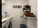 Laundry room with washer, dryer, and shelving at 803 E 21St St, Anderson, IN 46016