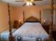 Spacious bedroom with a large wooden post bed and ample closet space at 3022 N Alaska Rd, Cloverdale, IN 46120