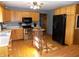 Kitchen features wood cabinets, stainless steel appliances, and hardwood floors at 3022 N Alaska Rd, Cloverdale, IN 46120