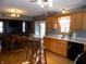 Bright kitchen with wood cabinets, stainless steel appliances, and hardwood floors at 3022 N Alaska Rd, Cloverdale, IN 46120