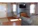 Living room with hardwood floors, gray sofas, and a recliner at 3022 N Alaska Rd, Cloverdale, IN 46120