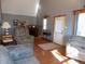 Living area with hardwood floors, gray sofas, and a fireplace at 3022 N Alaska Rd, Cloverdale, IN 46120