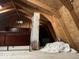 Large attic space with a queen-size bed and storage at 4025 N Campbell Ave, Indianapolis, IN 46226