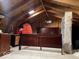 Finished attic with wood floors, skylight, and ample storage space at 4025 N Campbell Ave, Indianapolis, IN 46226