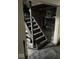 Basement stairs leading down to unfinished basement area at 4025 N Campbell Ave, Indianapolis, IN 46226