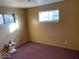 Bedroom with purple carpet and one window at 4025 N Campbell Ave, Indianapolis, IN 46226