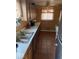 Kitchen with wood cabinets and tile floor at 4025 N Campbell Ave, Indianapolis, IN 46226