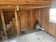 Unfinished storage room with wooden walls and carpeted floor at 4025 N Campbell Ave, Indianapolis, IN 46226