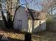 Tan shed with a barn-style roof at 4025 N Campbell Ave, Indianapolis, IN 46226