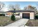 Ranch-style home with attached garage and mature landscaping at 4108 Patricia St, Indianapolis, IN 46222