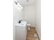 Clean and updated half bathroom with a pedestal sink at 6015 S State Road 75, Coatesville, IN 46121