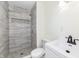 Updated bathroom with a walk-in shower, toilet and vanity at 6015 S State Road 75, Coatesville, IN 46121