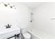Clean bathroom with white subway tile and a tub/shower combo at 6015 S State Road 75, Coatesville, IN 46121