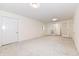 Well-lit bedroom with carpeting and double french doors at 6015 S State Road 75, Coatesville, IN 46121