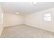 Spacious bedroom with neutral carpeting and large windows at 6015 S State Road 75, Coatesville, IN 46121