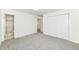 Bedroom with grey carpet, ensuite bathroom access, and large closet at 6015 S State Road 75, Coatesville, IN 46121
