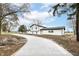 Newly constructed home with a long driveway and landscaping at 6015 S State Road 75, Coatesville, IN 46121