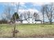 Ranch-style home with a large backyard and mature trees at 6015 S State Road 75, Coatesville, IN 46121